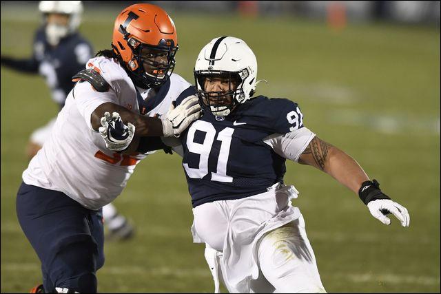 Penn State defensive tackle Dvon Ellies (91) fights off a block by Illinois offensive lineman Verdis Brown (52) during the Nittany Lions' season-ending victory Saturday.