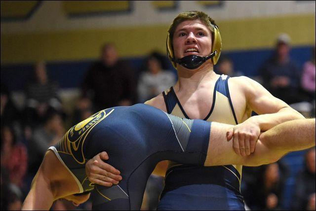 Butler's Nate McMaster scores a takedown during a match against Mars last season. The Golden Tornado senior needs 22 wins to reach 100 in his wrestling career.