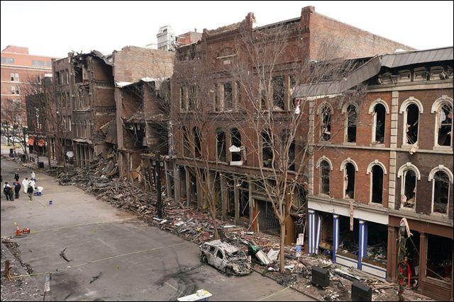 Debris remains on the sidewalks Tuesday in front of buildings damaged in a Christmas Day explosion in Nashville, Tenn.