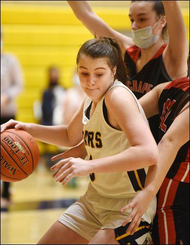Mars' Ava Black (5) drives the baseline in the third period of the Lady Planets' 54-45 basketball loss to Fox Chapel.
