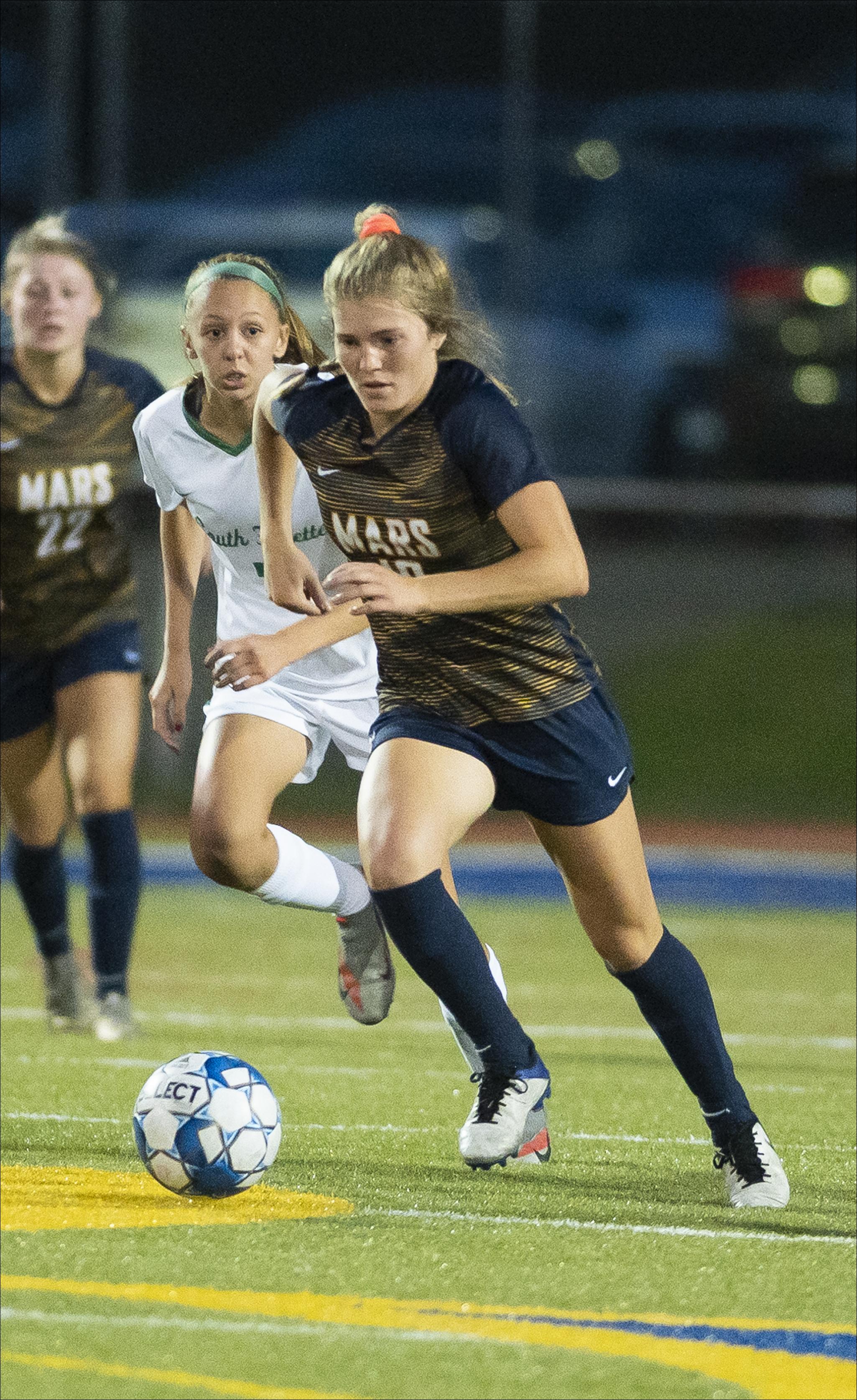 Mars' Gwen Howell gains possession of the ball during the Planets' 4-0 girls soccer victory over South Fayette Monday night. Mars (5-0-1) has not allowed a goal this season.