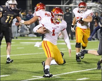 North Catholic quarterback Joey Prentice looks for open space on a quarterback run against Freeport Friday.