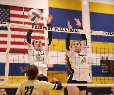 Freeport's Cassidy Dell, left, and Hadley Hellgren go up for a block during a match against Knoch earlier this season. The Yellowjackets are the top seed in the WPIAL Class 3A playoffs, while North Catholic is No. 1 in the Class 2A tournament.